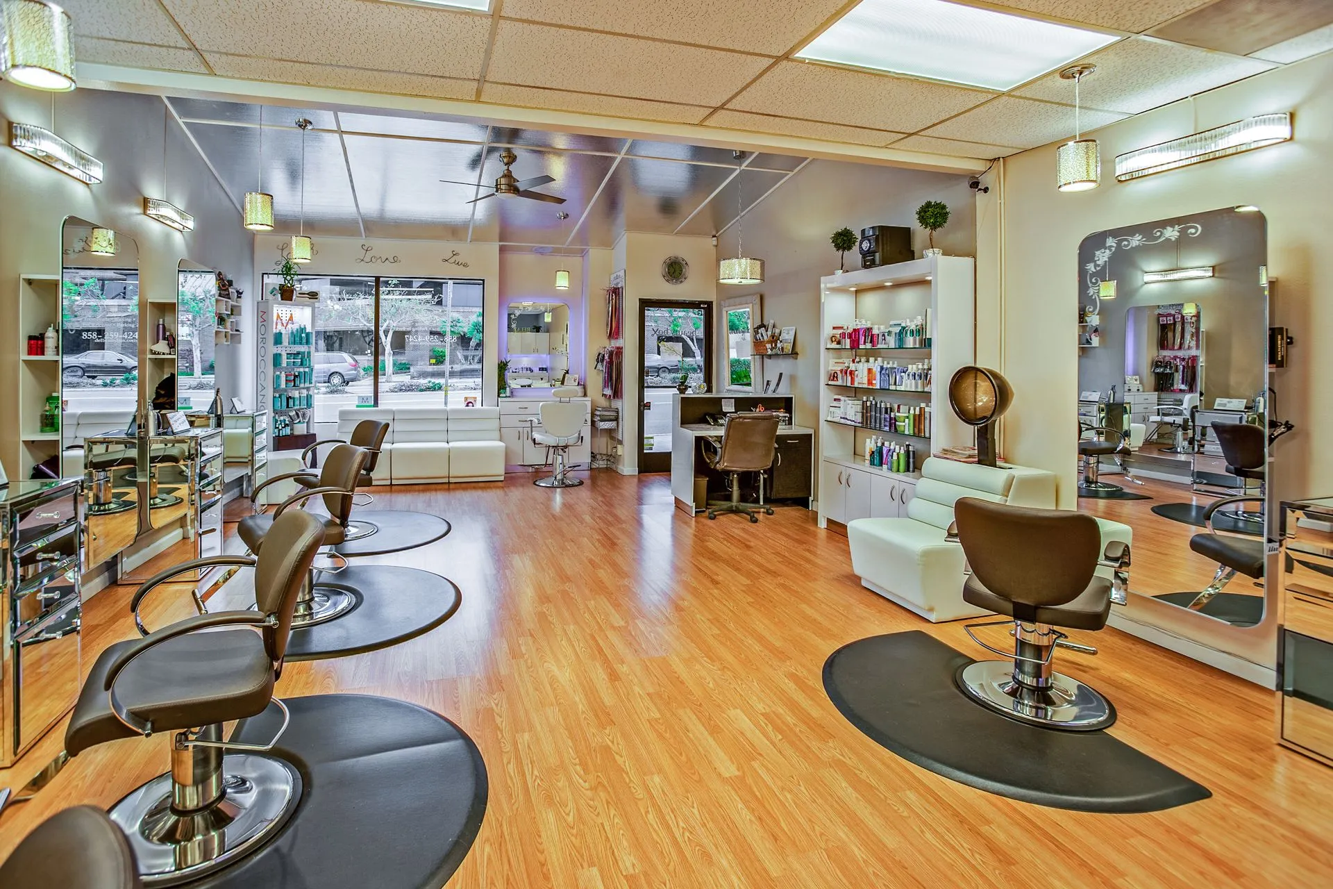 Salon styling stations with mirrors and chairs